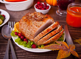 Traditional sliced honey glazed ham for festive Christmas or Thanksgiving table