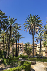 Fototapeta na wymiar Park Villa near Cathedral of Palermo - 30,000 m2 Public Park founded in second half of XIX century. Park Villa characteristic are lush palm trees. Palermo, Sicily, Italy.