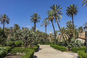 Obraz na płótnie Canvas Park Villa near Cathedral of Palermo - 30,000 m2 Public Park founded in second half of XIX century. Park Villa characteristic are lush palm trees. Palermo, Sicily, Italy.
