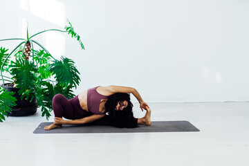 Beautiful woman yoga asana stretching the flexibility of body fitness gymnastics