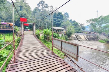 Fototapeta premium Wooden Suspension Bridge at Kiriwong Village