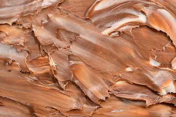 Naklejka premium Chocolate cream background. Space for text or design.
