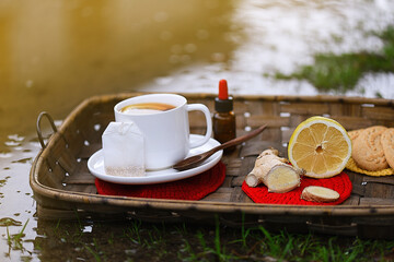 Autumn personal care concept with an outdoor ginger hot lemon and propolis breakfast