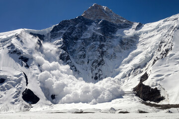 Huge avalanche from Khan Tengri peak (7010 m), Central Tian Shan, Kazakhstan. - obrazy, fototapety, plakaty