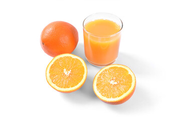 Orange juice in glass with oranges on white background