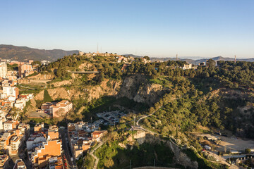 Fototapeta na wymiar Aerial drone shot of MUHBA Turo de la Rovira hill in Barcelona in morning