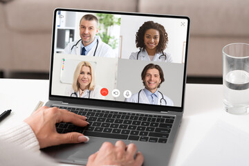 Fototapeta na wymiar Unrecognizable Lady Making Video Call Consulting With Doctors At Home