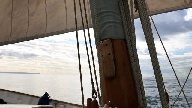 Mast of an old llaut style boat sailing in mallorca