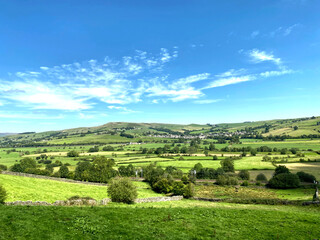 Fototapeta premium Landscape view, across the Airedale Valley, with railway line, villages, and hills, in the far distance in, Skipton, Yorkshire, UK