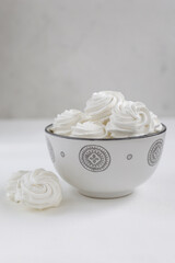 Fresh airy handmade vanilla marshmallows in a vase against a light background