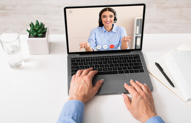Business Lady Using Laptop Talking With Remote Colleague In Office