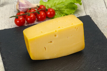 Hard yellow tasty cheese brick