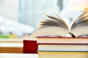 Books lying on the table in the public library