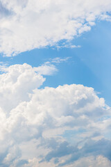 Beautiful white fluffy clouds on a blue sky background