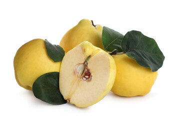 Ripe fresh quinces with green leaves on white background