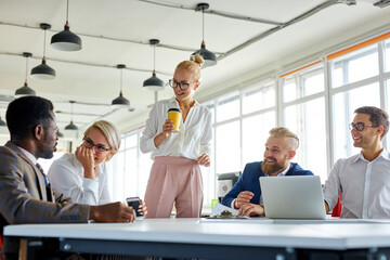 business lady hold conference with employees in the office, cuacasian team of workers sit at table talking, hving conversation