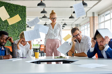 angry unbalanced female boss scream, scolds employees for not fulfilling the plan at work....