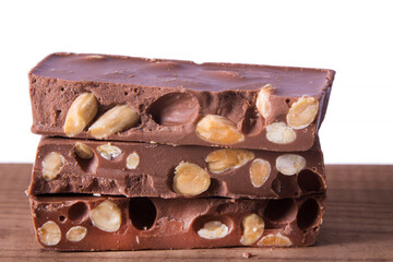 Almond nougat, typical Christmas dessert on wooden background