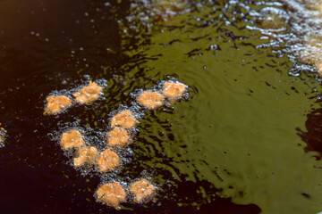 chef cooking deep-fried shrimp in the big pan to chinese banquet food preparation. fat from trans-fat concept. disease from cholesterol and Trans-fatty concept.