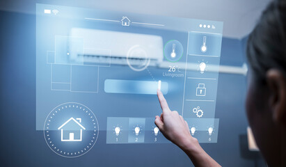 Smart home modern technology Asian girl sitting living room finger touching controlling remote system navigating adjusting functions light temperature and security setting, UI hologram screen display