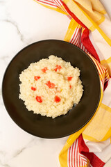 Lemon risotto with pomegranate syrup on top.