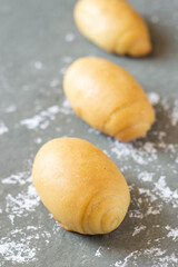 Oil bread buns homemade on a grey background