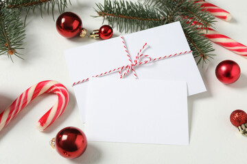 Blank greeting cards and Christmas decor on white background. Space for text