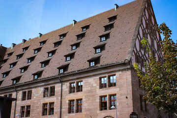 Naklejka premium Nuremberg, Germany - August 29, 2018: A look at old houses and rooftops in the city center