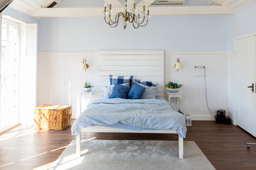 Nice cozy interior of a spacious room in gentle blue tones