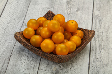Fresh yellow cherry tomato heap