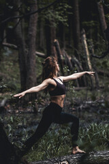 Girl go in for sports in the forest. Exercises, gymnastics, relaxation. Healthy lifestyle.