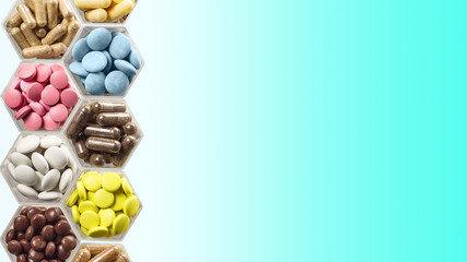Medical capsules and pills in hexagonal jars on blue background