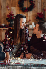 a guy and a girl celebrate the new year together. and give each other gifts