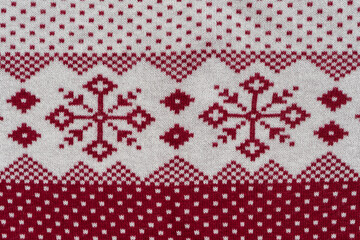 Norwegian Pattern Of Red And White Yarn. Fair Isle Ornament At Cozy Knitted Cloth. Wallpaper. Yarn Knitted Background