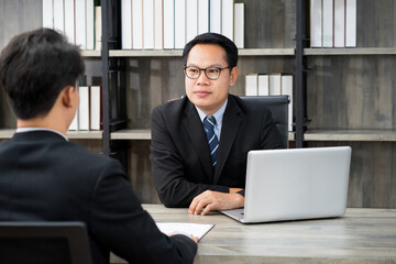 Asian businessman wearing formal suit interview new candidate for employment in the office work from home. 