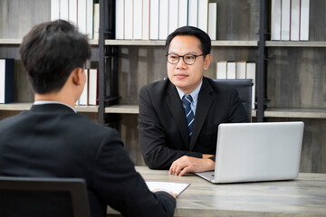 businessman wearing formal suit interviewing new candidate for new employment position in the financial office. new normal work from home concept. 