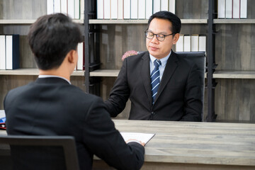 businessman wearing formal suit interviewing new candidate for new employment position in the...
