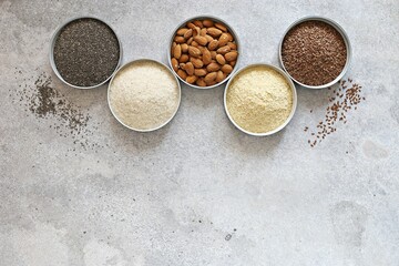 Super food dry ingredients group. Healthy, vegetarian, plant based, clean eating concept. Overhead view