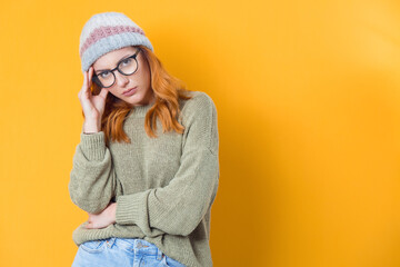 Tired girl looking at camera, isolated on white background.Exhausted female. Sleepy expression