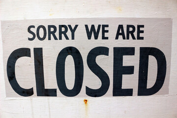 Sorry we are closed, shop sign apologising for being shut
