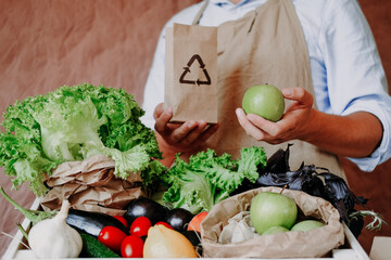 shop with vegetables and fruits where they are Packed in a paper bag. The theme of ecology
