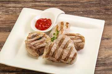 Grilled pork tenderlion with tomato sauce