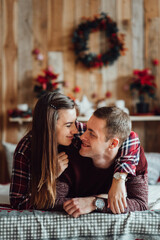 a guy and a girl celebrate the new year together. and give each other gifts