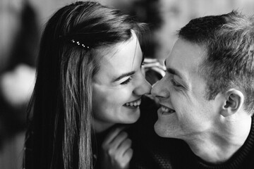 a guy and a girl celebrate the new year together. and give each other gifts