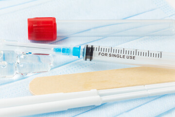 Sterile syringe with ampoules and blood test tube