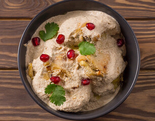 Traditional Georgian satsivi with chicken, nuts and pomegranate