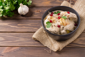 Traditional Georgian satsivi with chicken, nuts and pomegranate
