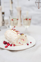 Meringue roll with crunberries and pistachios