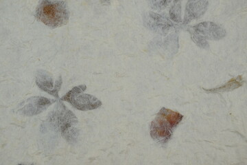 Handmade paper textured vintage background, papier czerpany z kwiatami niepowtarzalna retro tekstura na tło