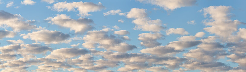 panorama of many white clouds in blue sky